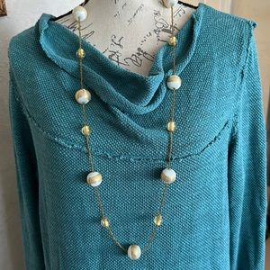 Blown glass gold and white beads long 40” in length all beads are different